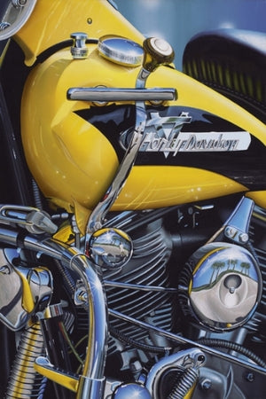 1956 Panhead motorcycle, up-close of engine and gas tank in bright yellow and black. 