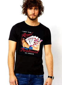 Black tee shirt with "I GOT THE ROYAL TREATMENT IN VEGAS" around a pinup girl wearing pink shoes and panties and no shirt. Behind her is a set of cards displaying a Full House. In front of her are several blue casino chips. Rated Adult