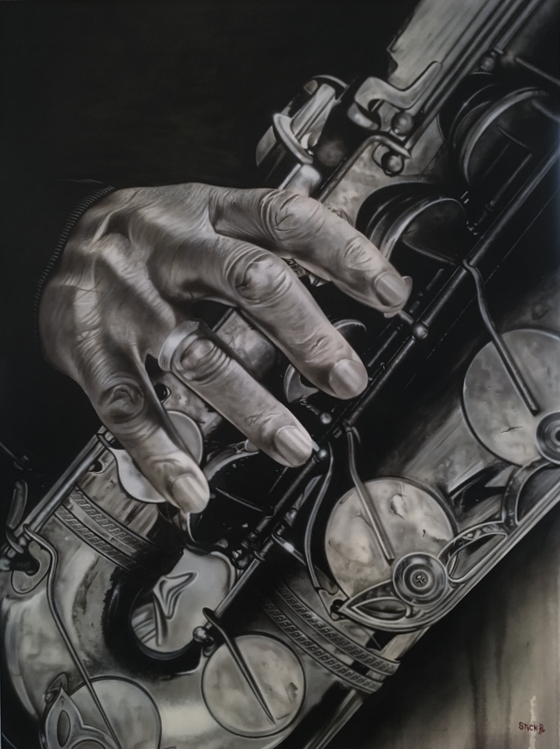 A black and white image with a closeup of a hand with its fingers placed on a heavily detailed saxophone. The background of the image is plain black on the upper left side and a off white on the lower right side. 