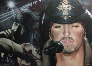 Bret Michaels is pictured facing forwards with a cowboy hat with a cross on it on his head, in front of a microphone. In the left background he is again shown, but with a bandana on singing into a microphone and pointing into an audience. There are also several red sculls and cross bones in the background, all wearing cowboy hats with crosses.