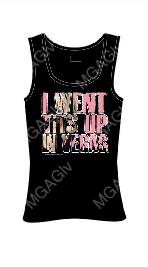 Women's black tee shirt with "I WENT TITS UP IN VEGAS" in pink lettering. Inside the lettering is a blonde woman wearing nothing but black pants, black sleeves, and black tape in the shape of an "X" on her nipples. Rated Adult. 